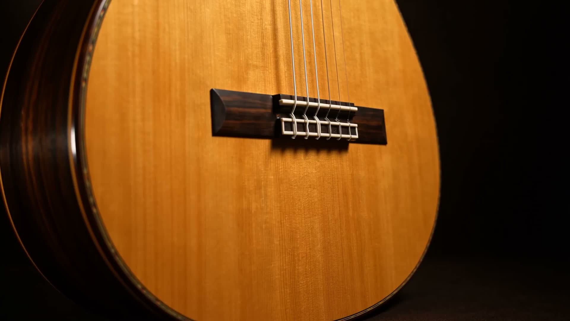 Macro of a handmade Spanish classical guitar in warm light
